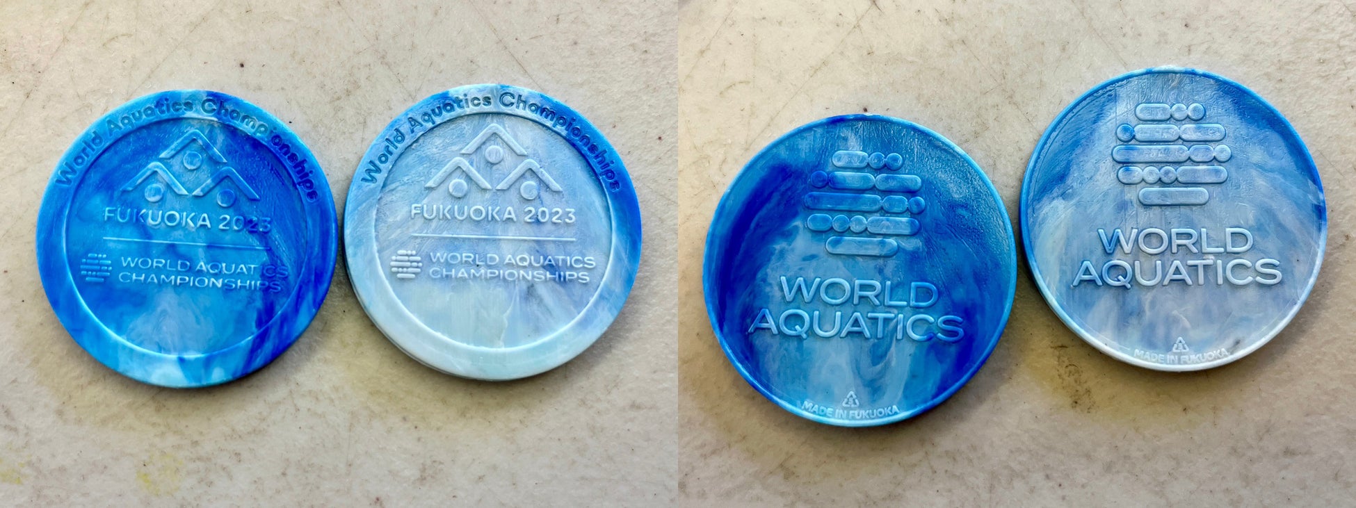 世界水泳選手権2023福岡大会の記念メダルを廃プラリサイクル工場TSUYAZAKI BASE CAMPが廃棄プラスチック(ペットボトルキャップ)から製作しました!!